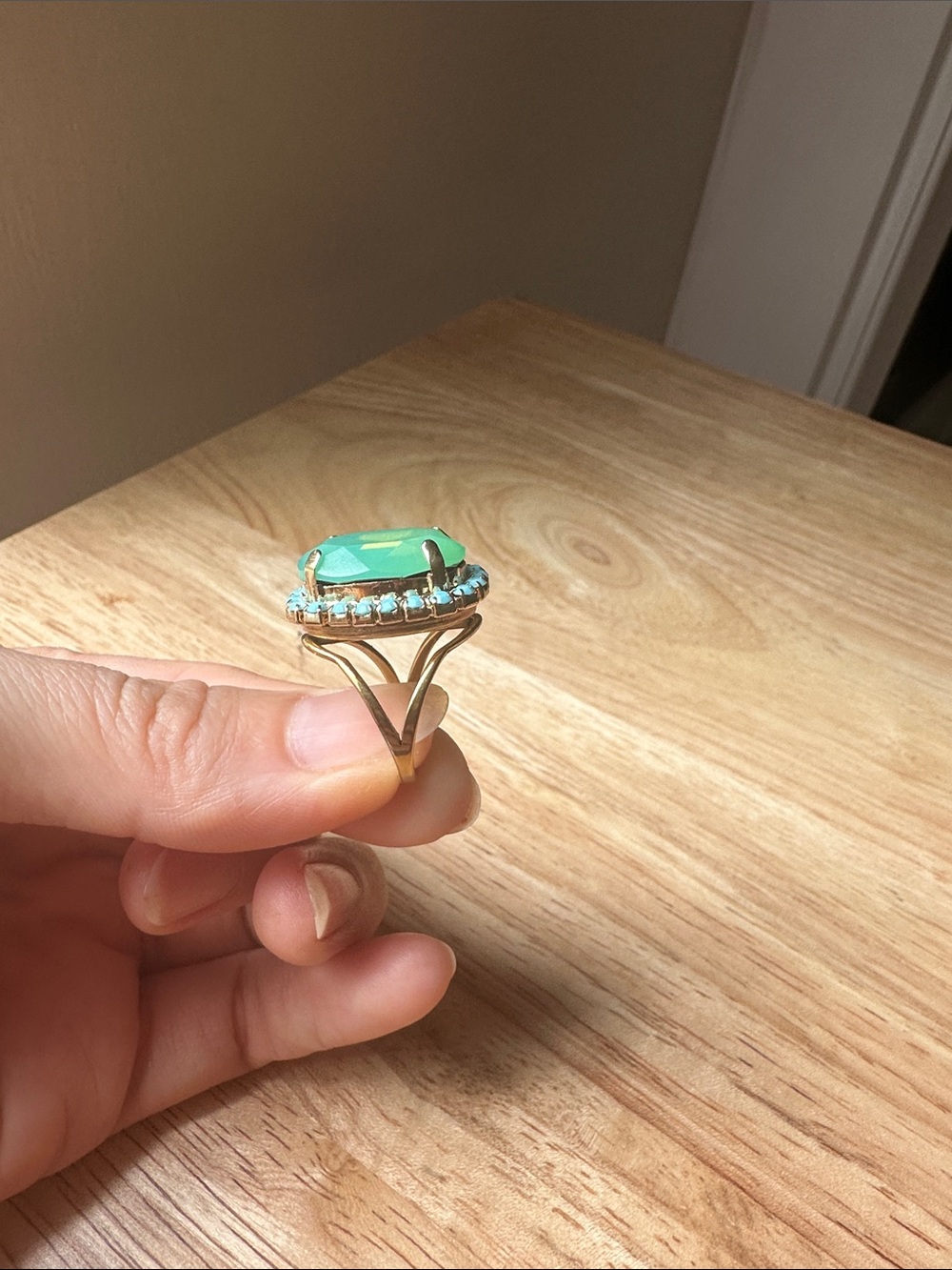 Gold Ring with Green Stone and Halo Accent